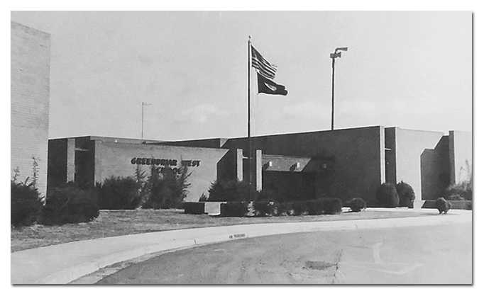 Black and white photograph of the main entrance to Greenbriar West Elementary School taken in 1980. The name of the school is on the side of the building. These letters were taken down when the school was renovated. 