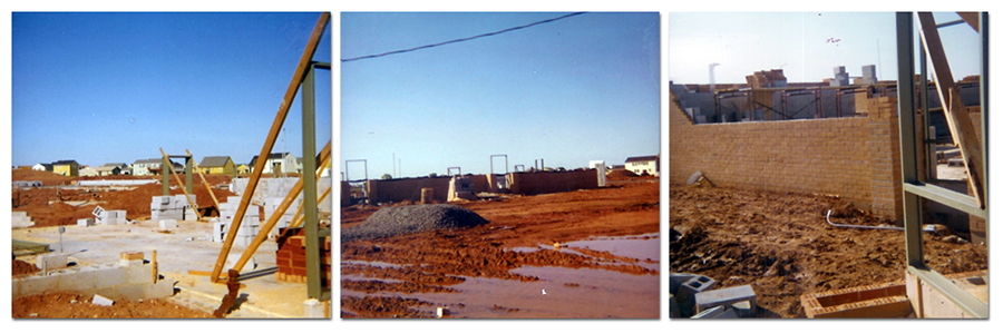Three color photographs of Greenbriar West Elementary School during stages of its initial construction. The photograph on the left shows the concrete pad, a partial brick wall, and stack of cinder blocks. Homes of the Greenbriar neighborhood can be seen in the distance. The center photograph shows the exterior walls of the building after they've been partially erected. The grounds in front of the school are very muddy and water has pooled in several places. The photograph on the right shows exterior and interior walls under construction. 